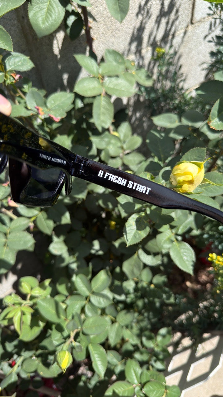 Black shades emphasizing “ A fresh start” in inner temple 