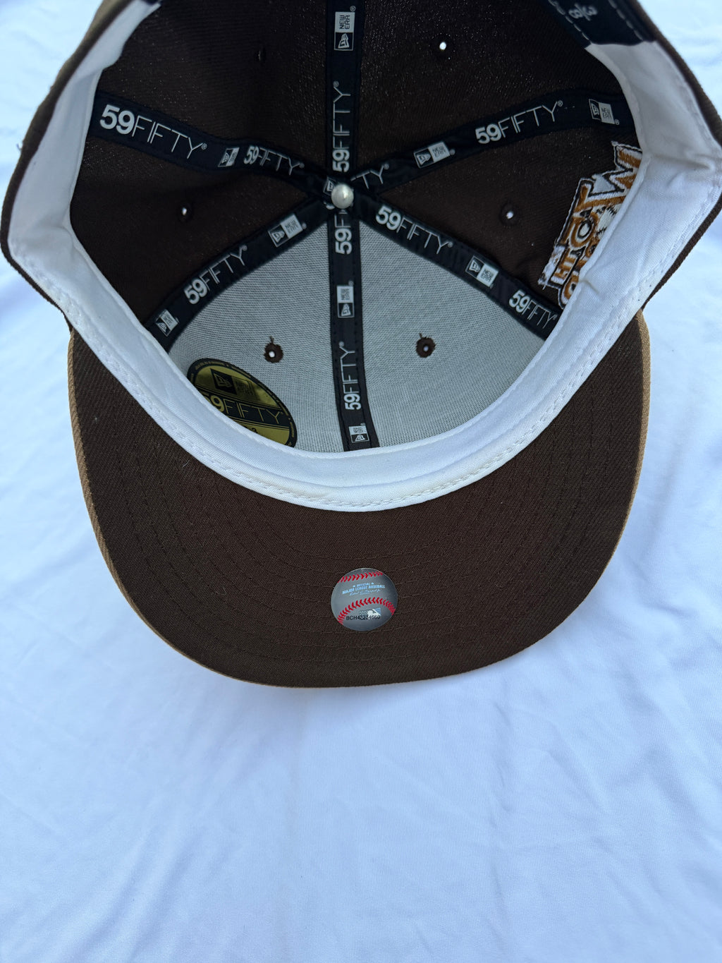bottom view of hat with dark brown underneath brim