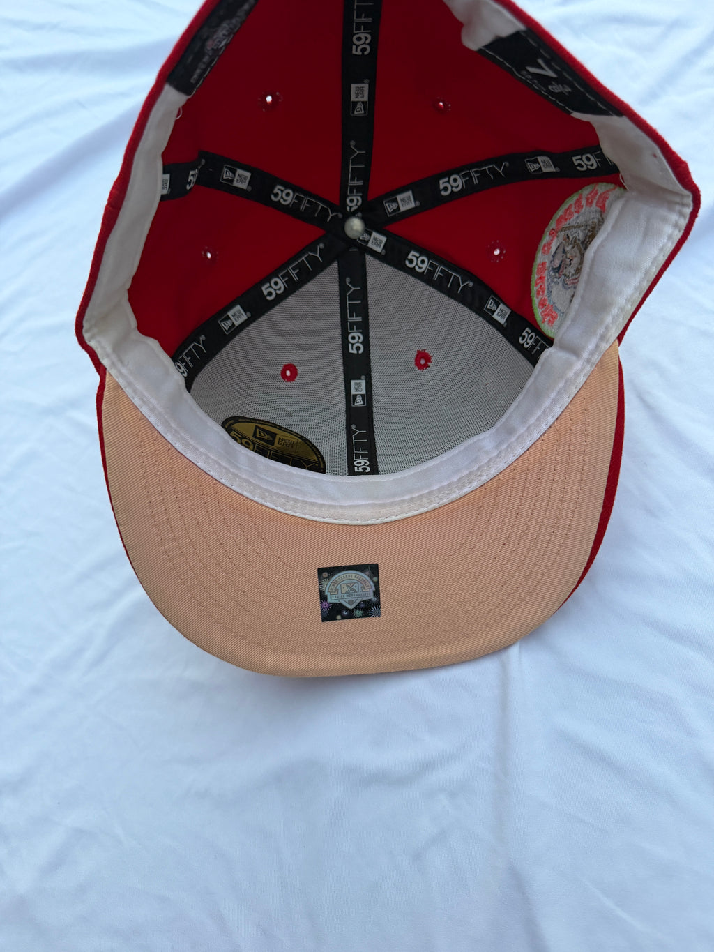 Bottom view of Red New Era 59FIFTY Buffalo Bisons cap with beige brim