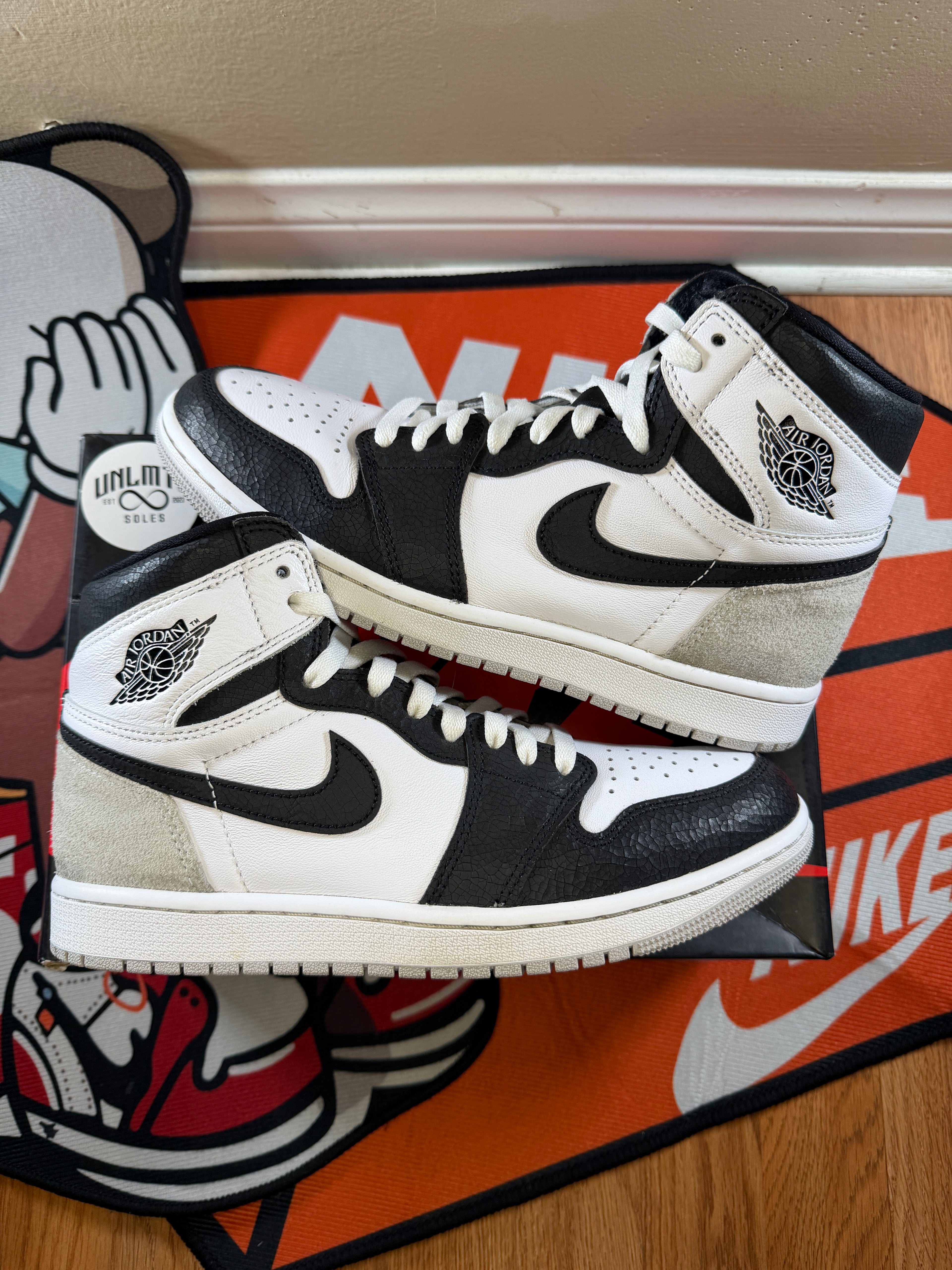 Jordan 1 retro High OG Bleached coral sneakers in white coral with black accents, featuring the classic high top silhouette, leather panels, and Nike swoosh on the sides. Preowned missing 1 black lace, size 8