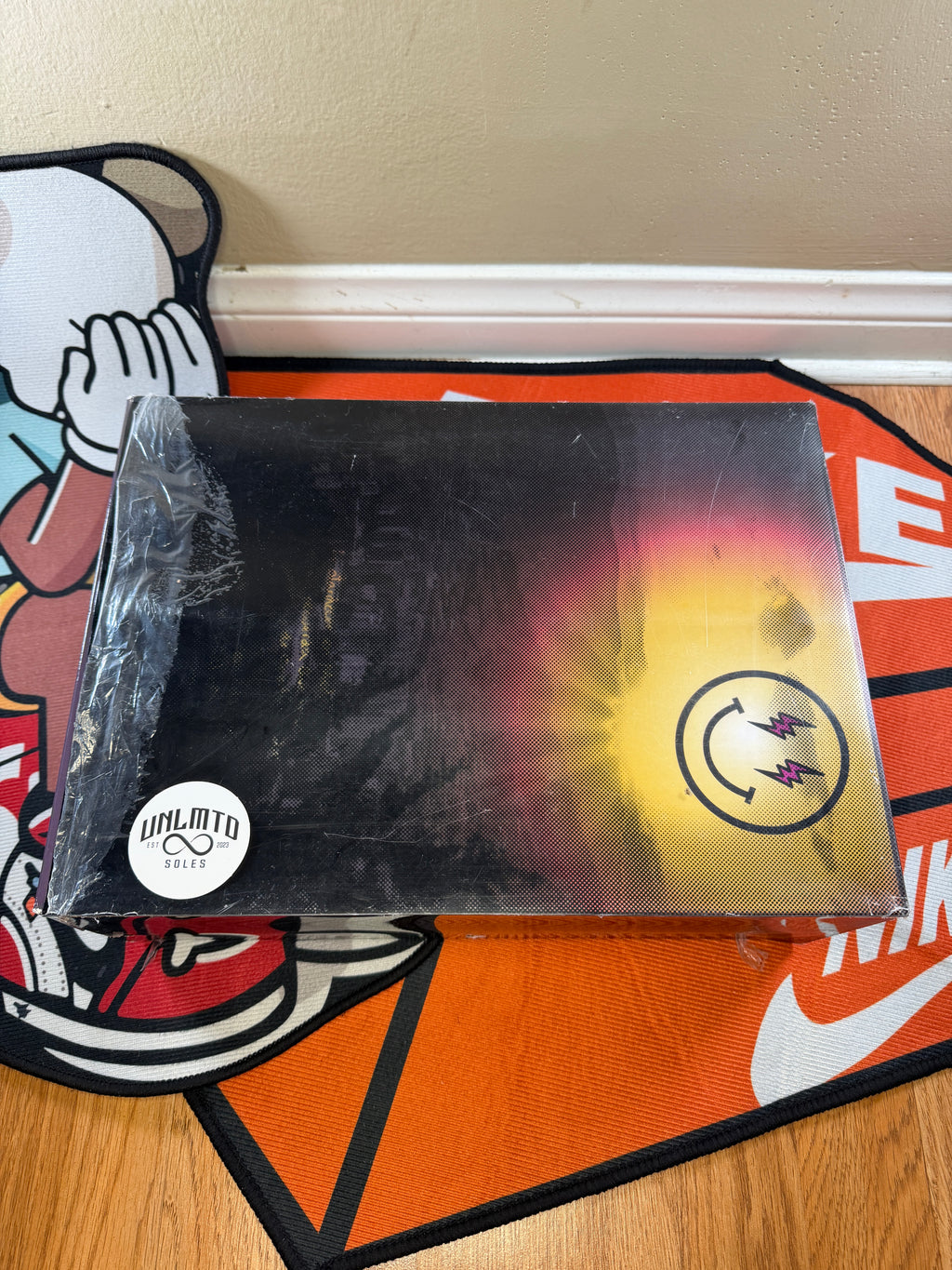 Detail picture of the fromt of the box box & box sleeve showing damage on sleeve 