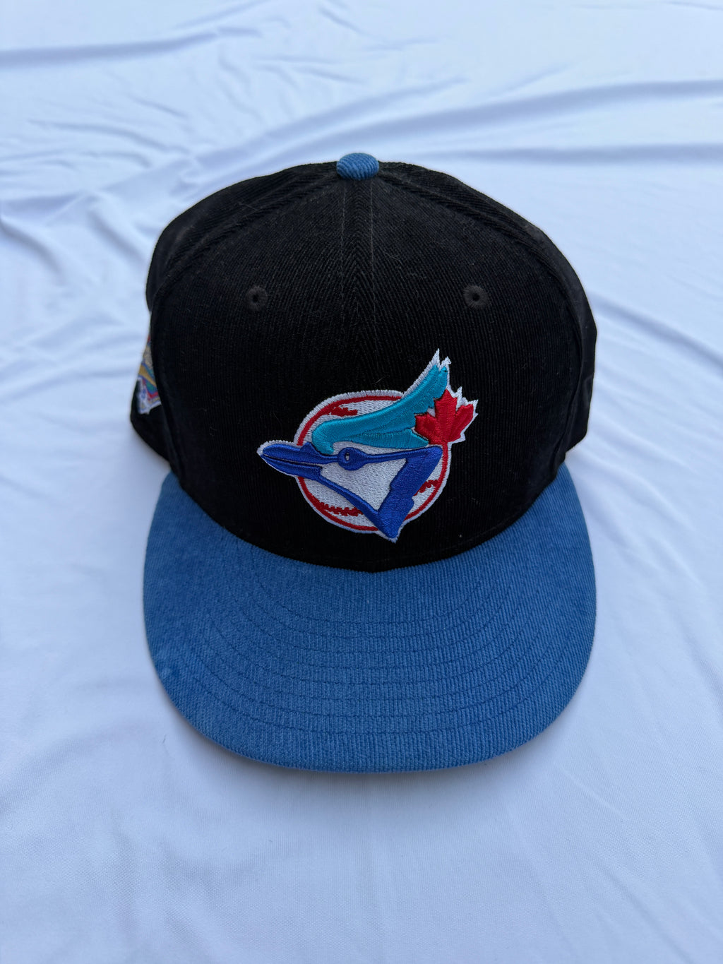 Black New Era Toronto Blue Jays Corduroy with blue brim and embroidered blue Jay 