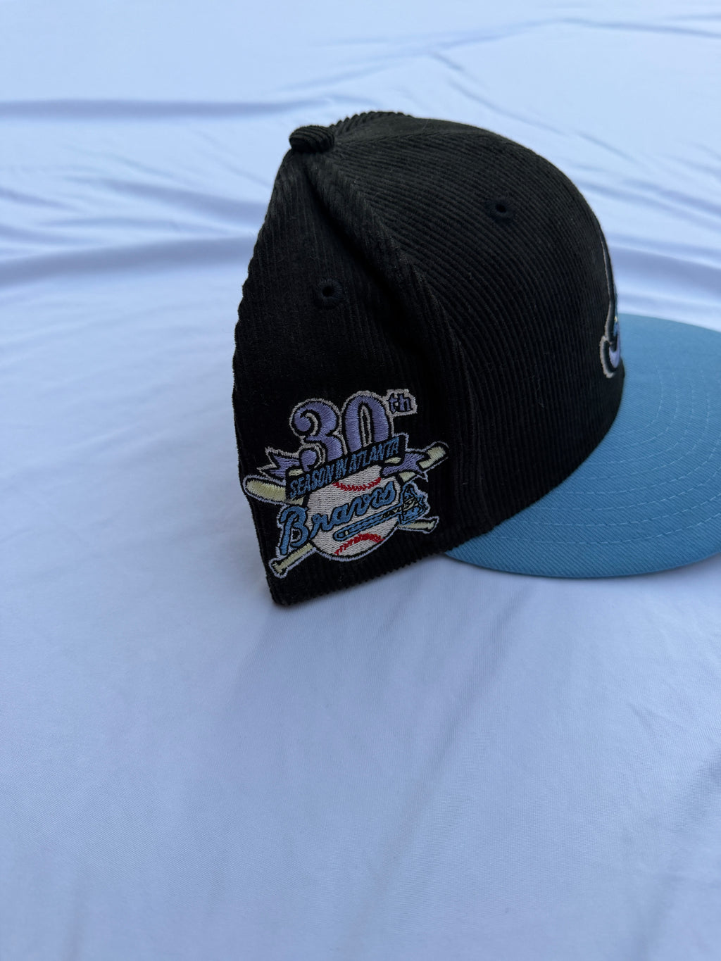 Left Side view of hat with “30th season in Atlanta” embroidered patch 