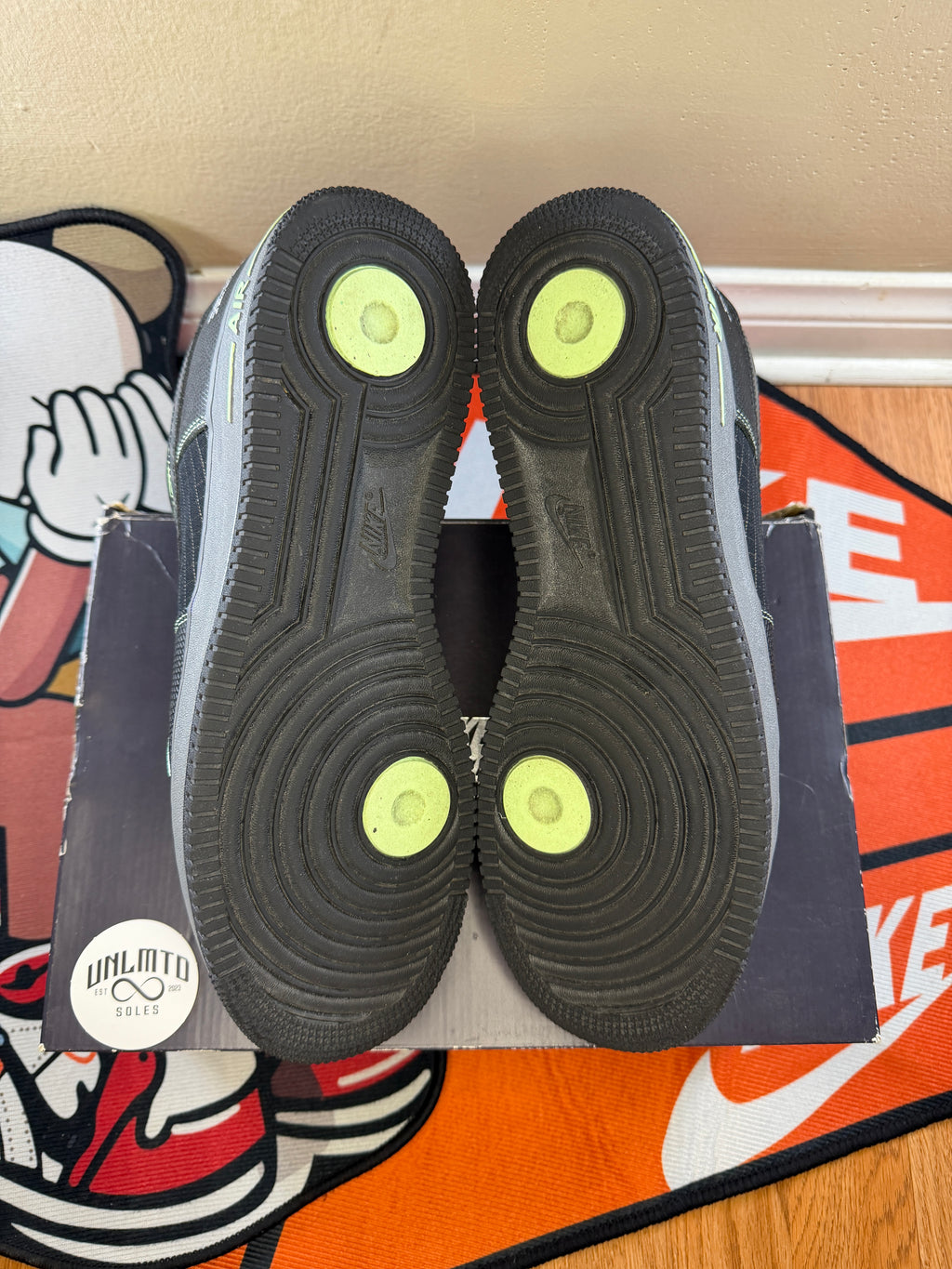 Black bottom soles with hints of neon green 