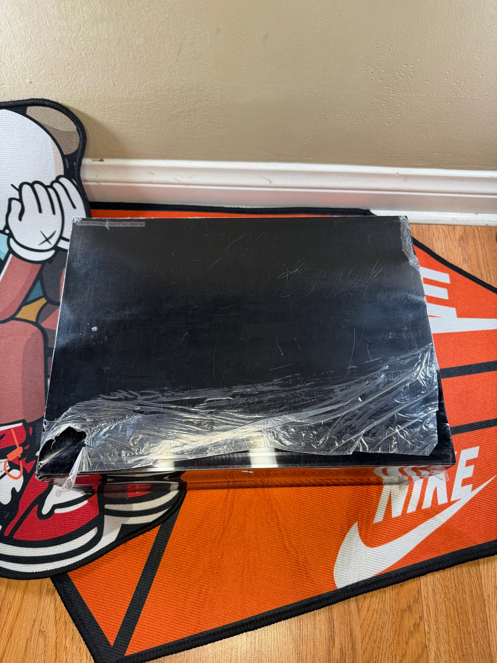 Detail picture of the back of the box box & box sleeve showing damage on sleeve 