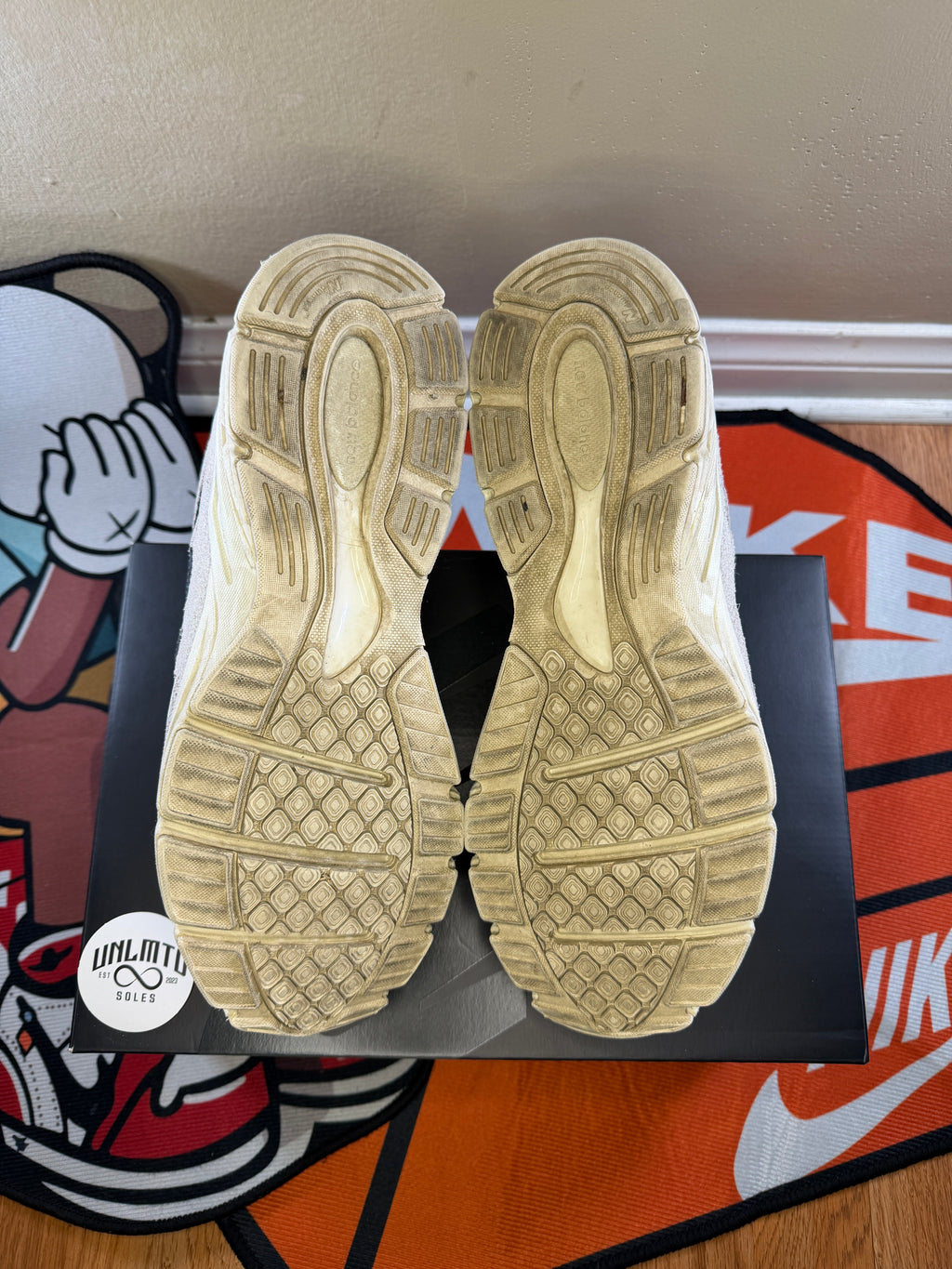 Bottom of shoes, cream soles,
Visibly worn