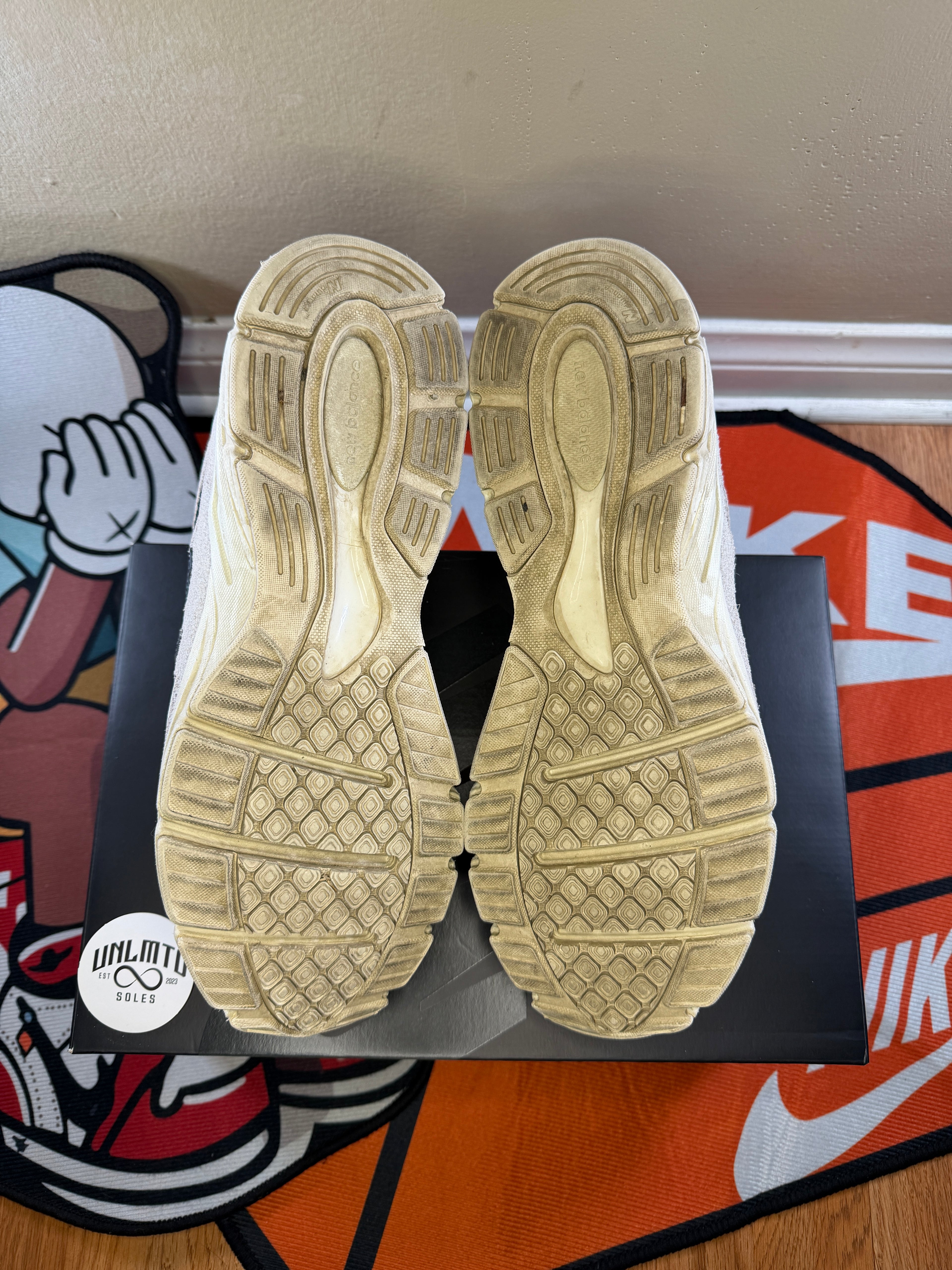 Bottom of shoes, cream soles,
Visibly worn