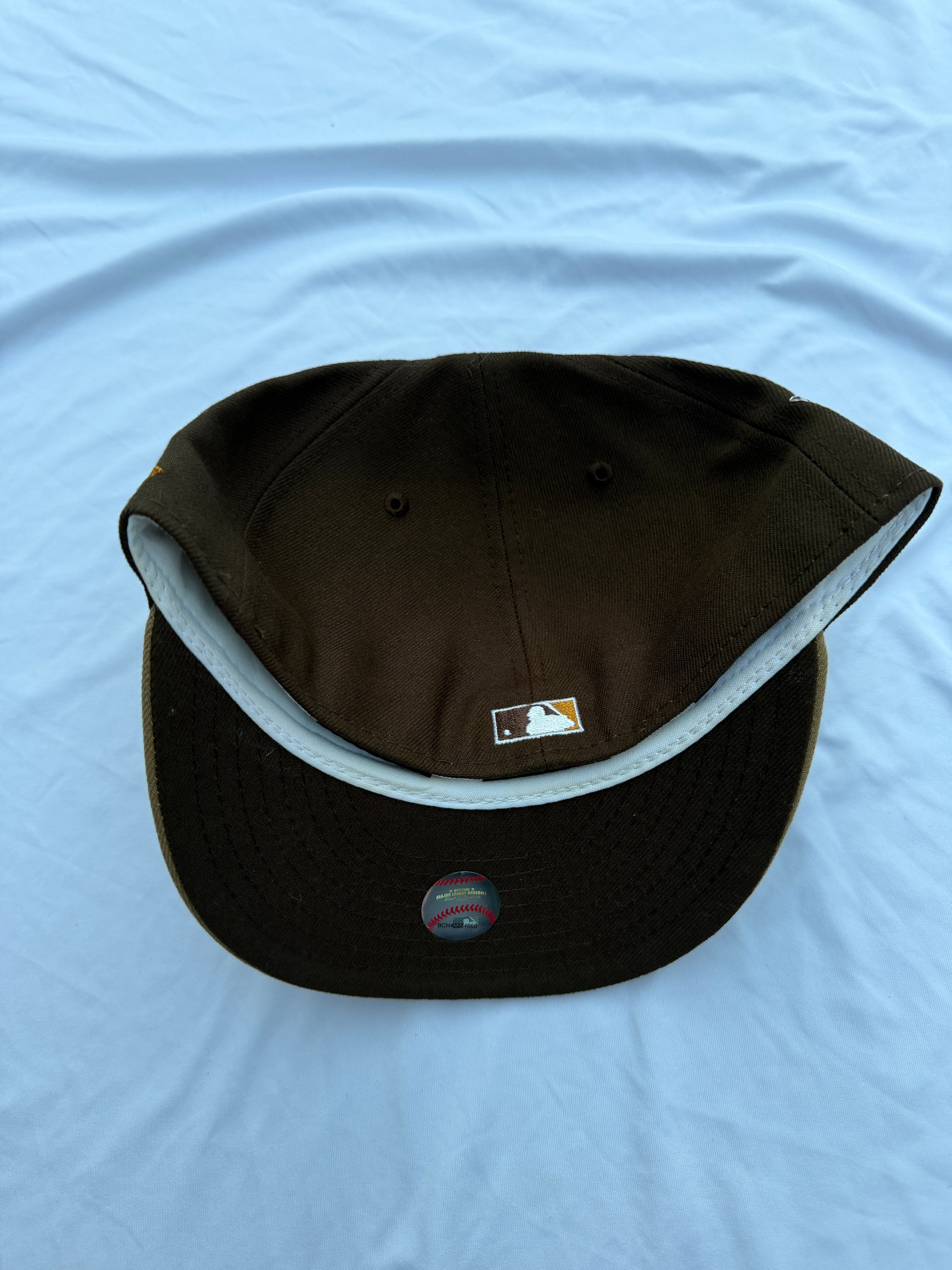 bottom view of cap with dark brown underneath brim