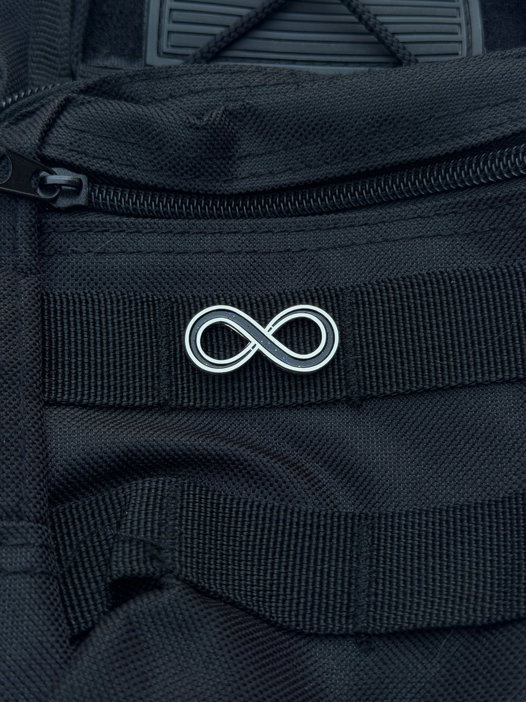 Close up of the pin on the backpack 