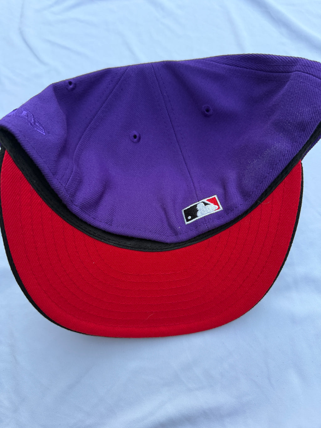 Bottom view of cap with red under brim 
