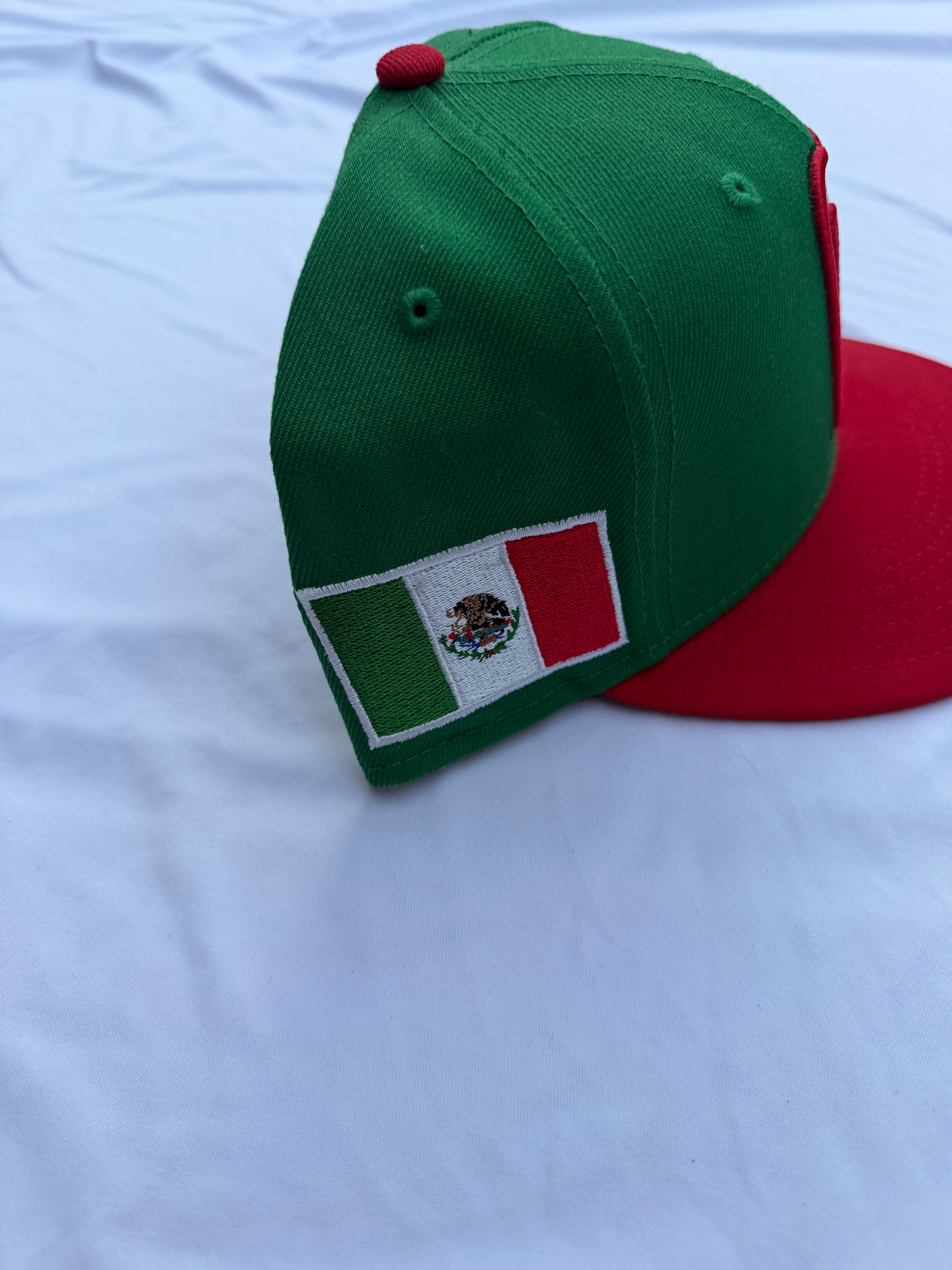 Side view of cap with embroidered Mexico flag on left side of cap 