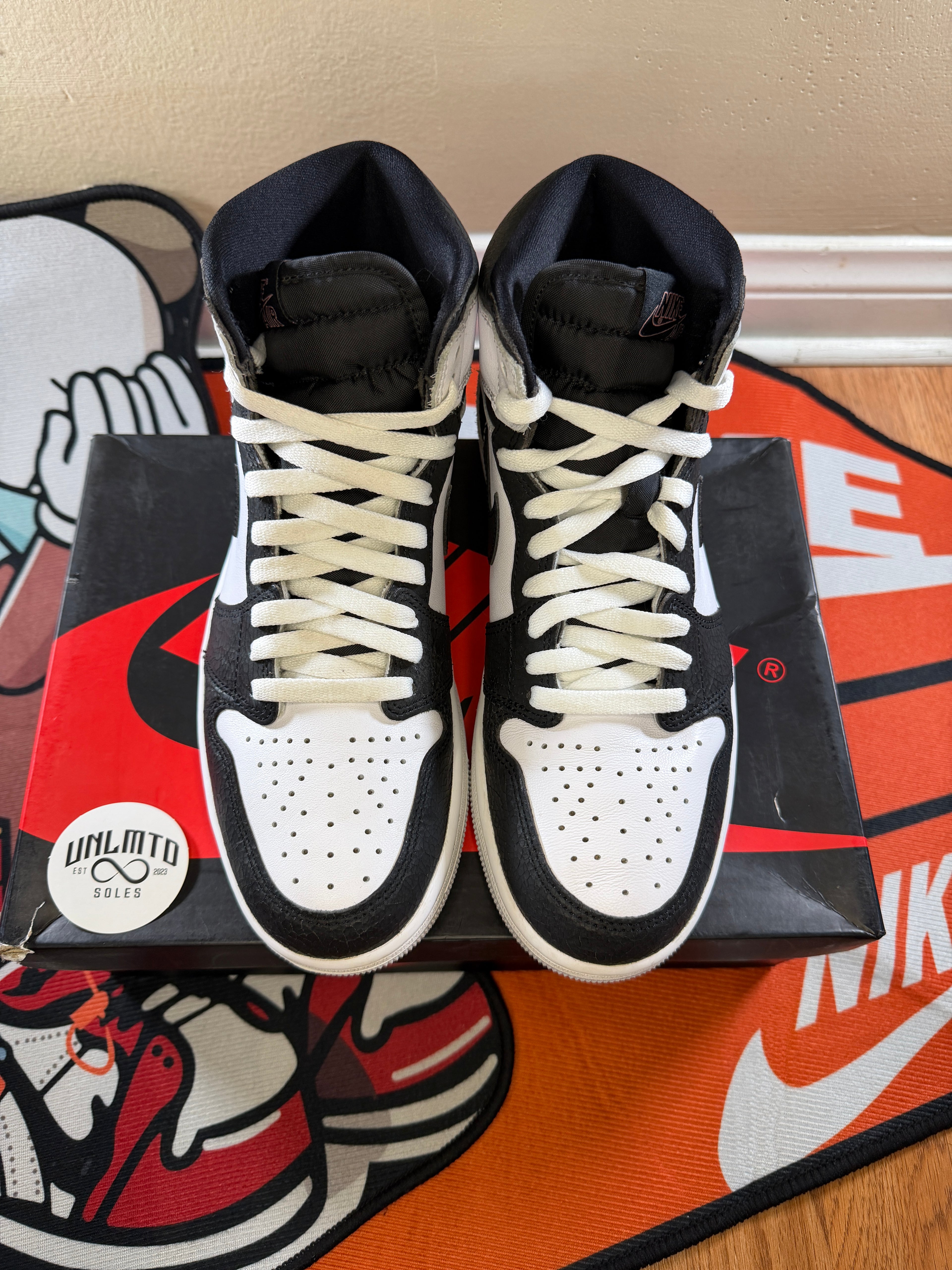 Jordan 1 retro High OG Bleached coral sneakers in white coral with black accents top view