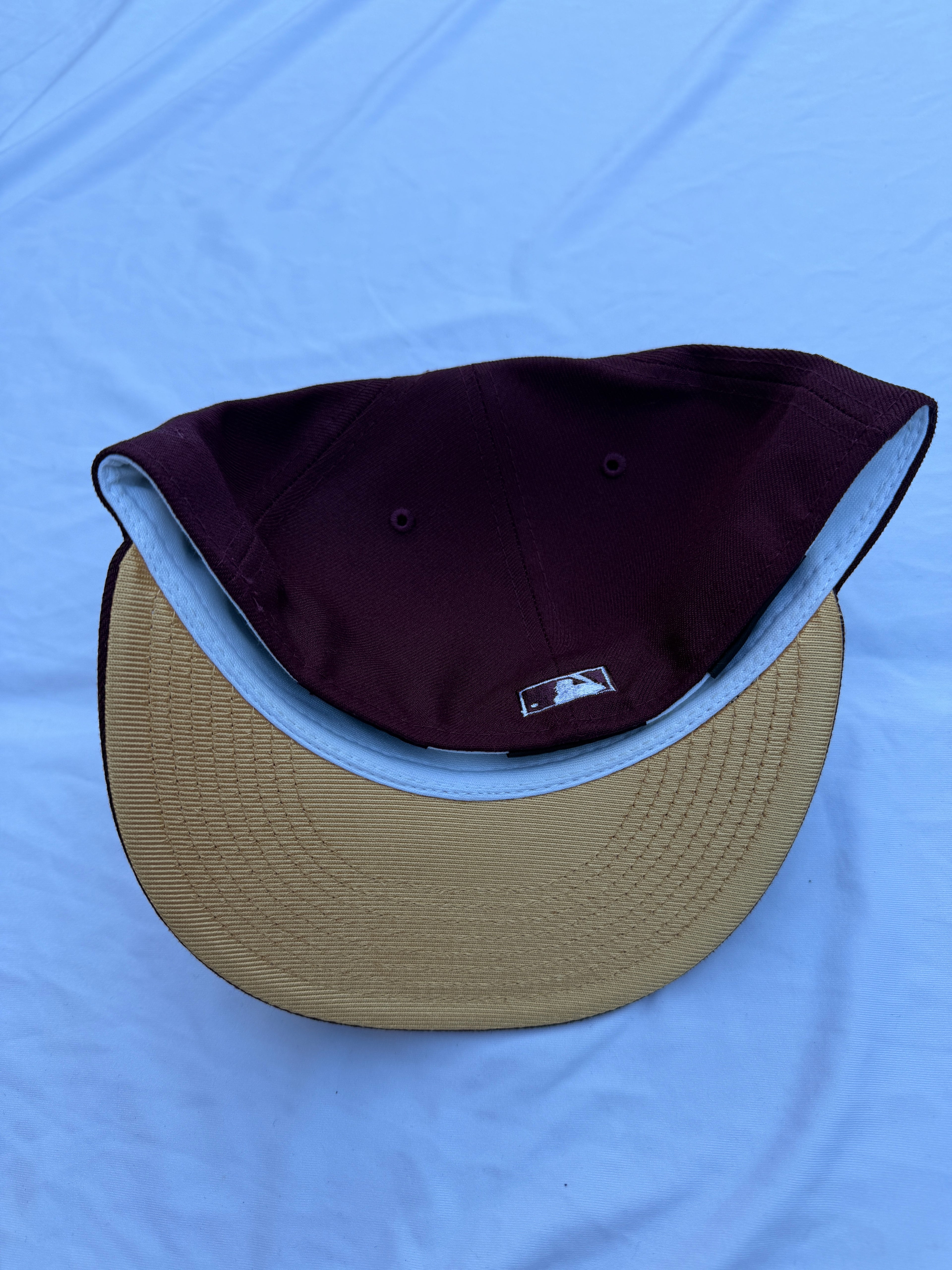 Bottom view of hat, beige under brim 