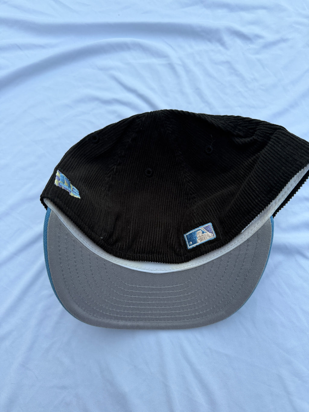 Bottom view of hat with grey under brim 