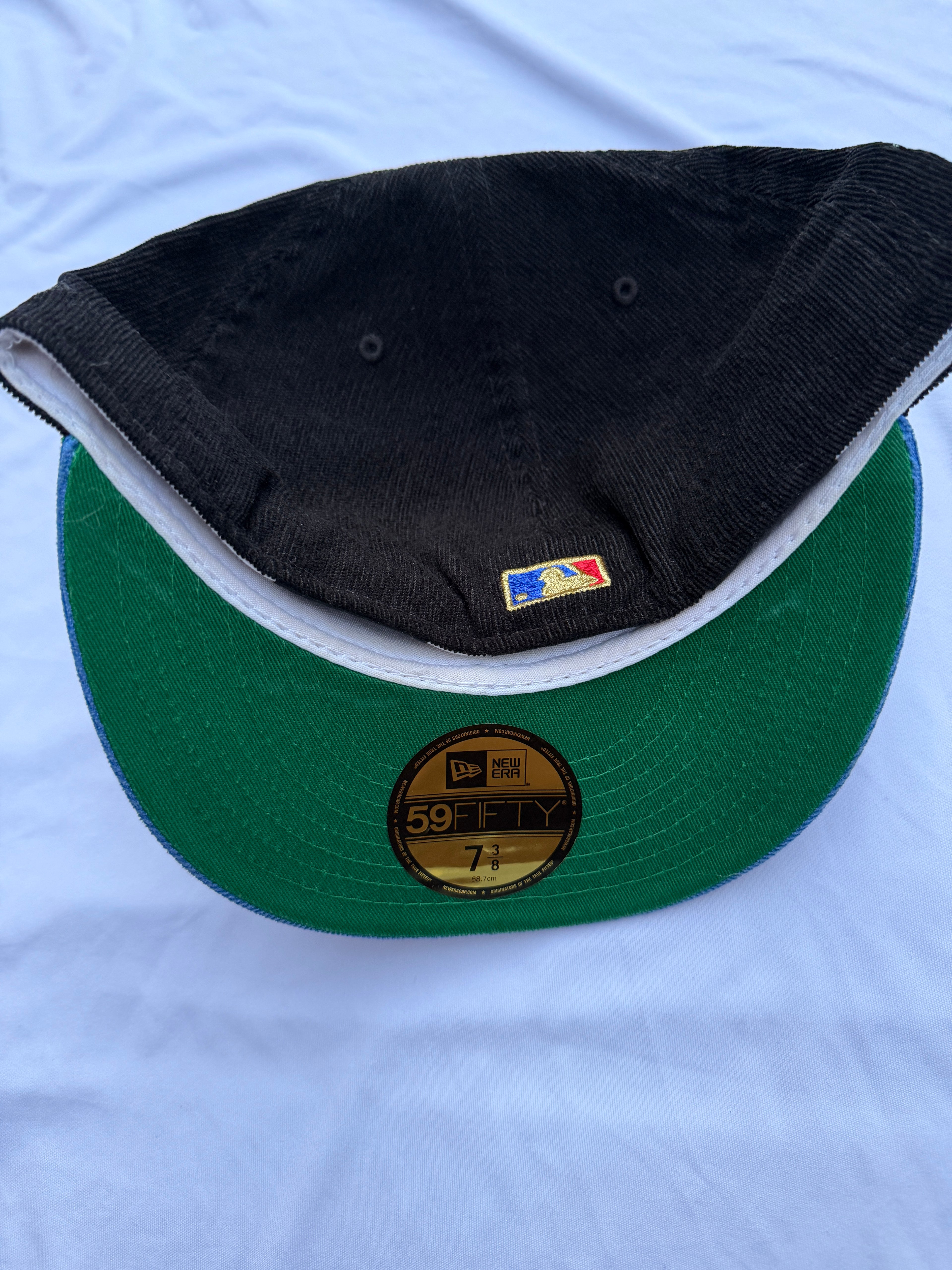 Bottom view of cap with green under brim 