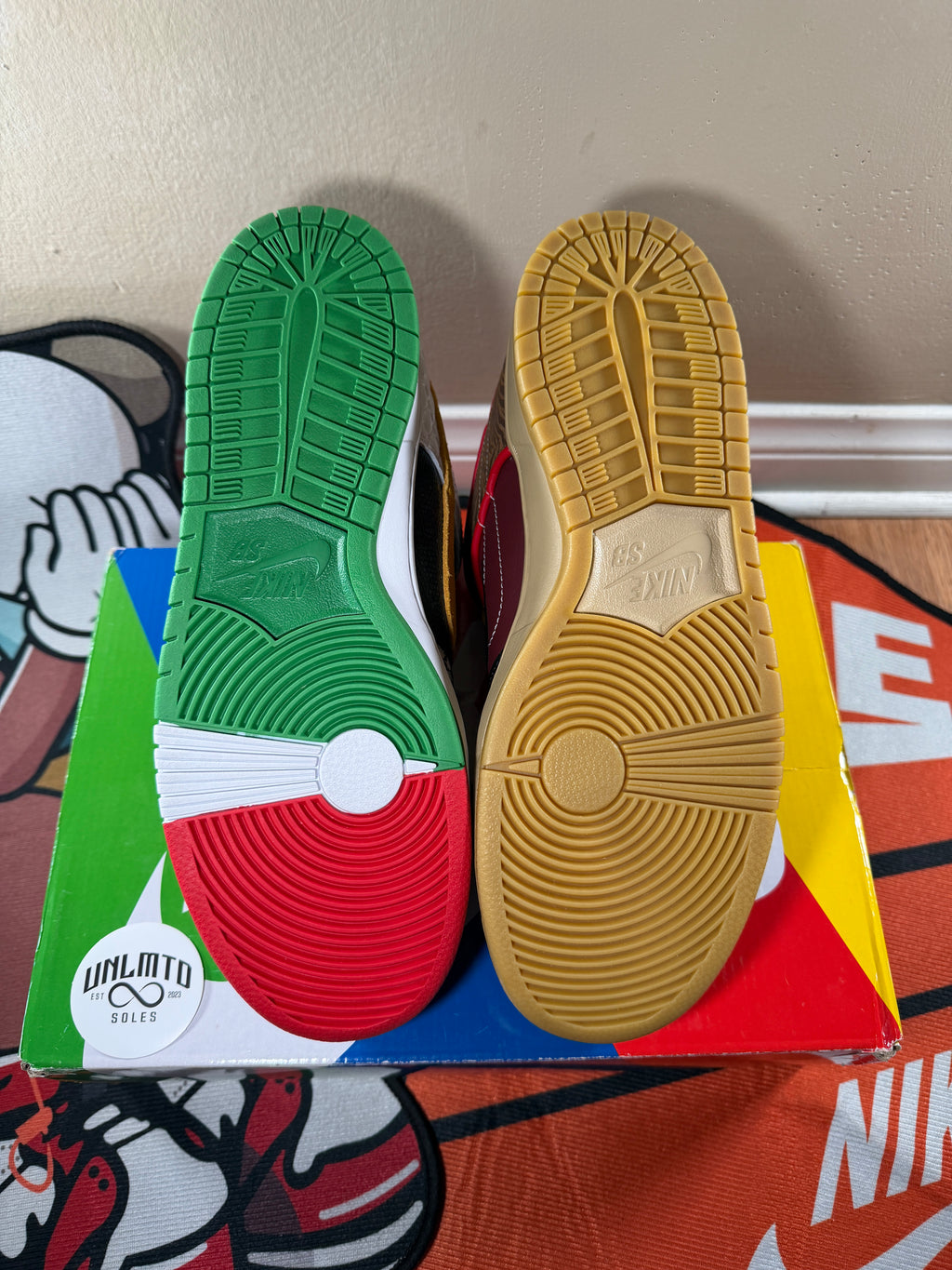 Bottom soles of shoes, left is green white and red, right is tan 