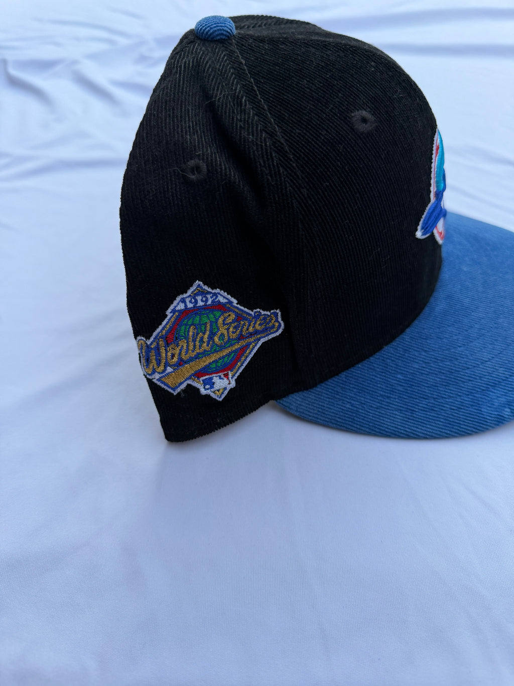 Left side view of cap with embroidered “1992 World Series” patch 