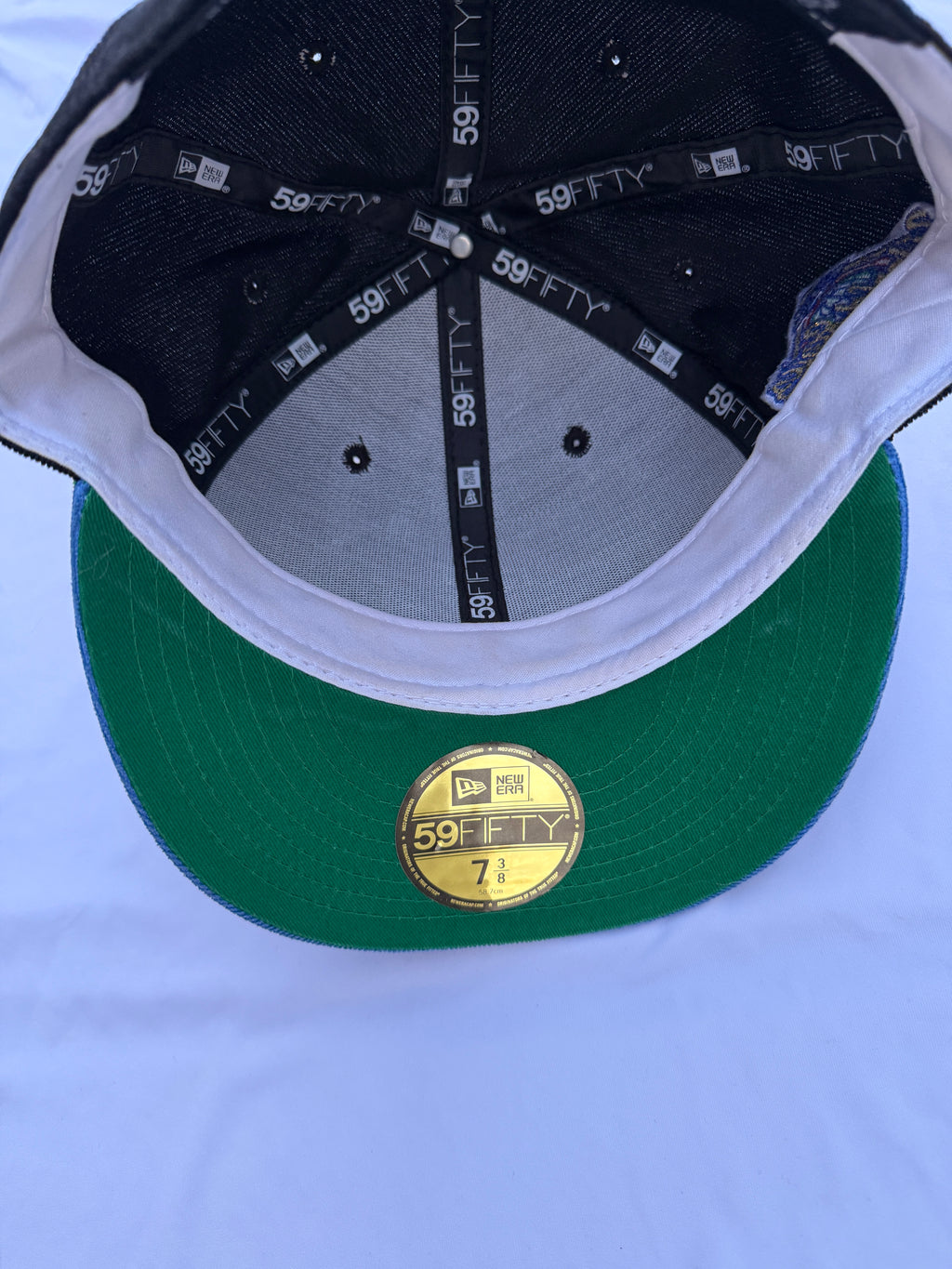 Inside of cap with green under brim 