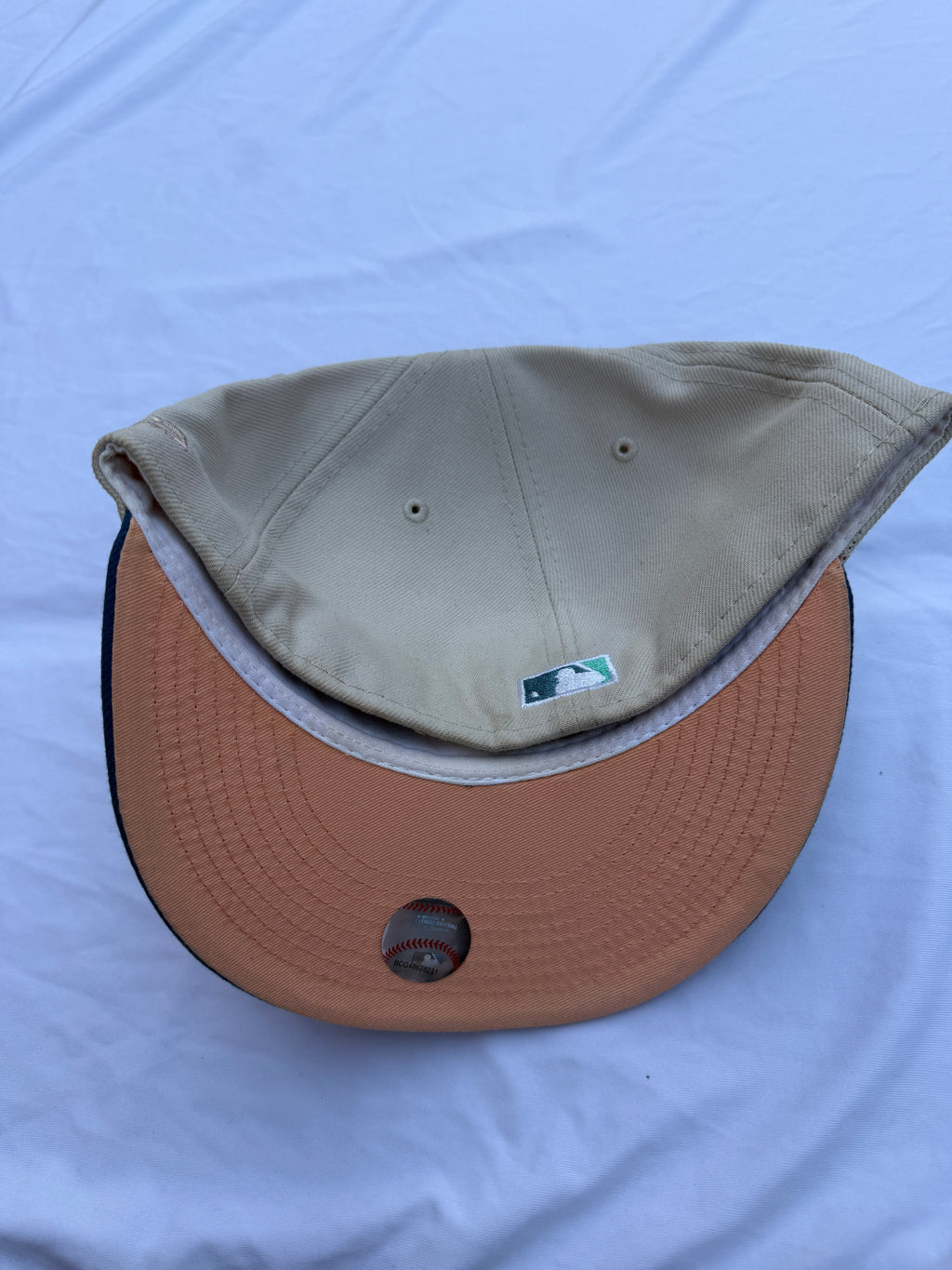 Bottom angle of hat, orange under brim 