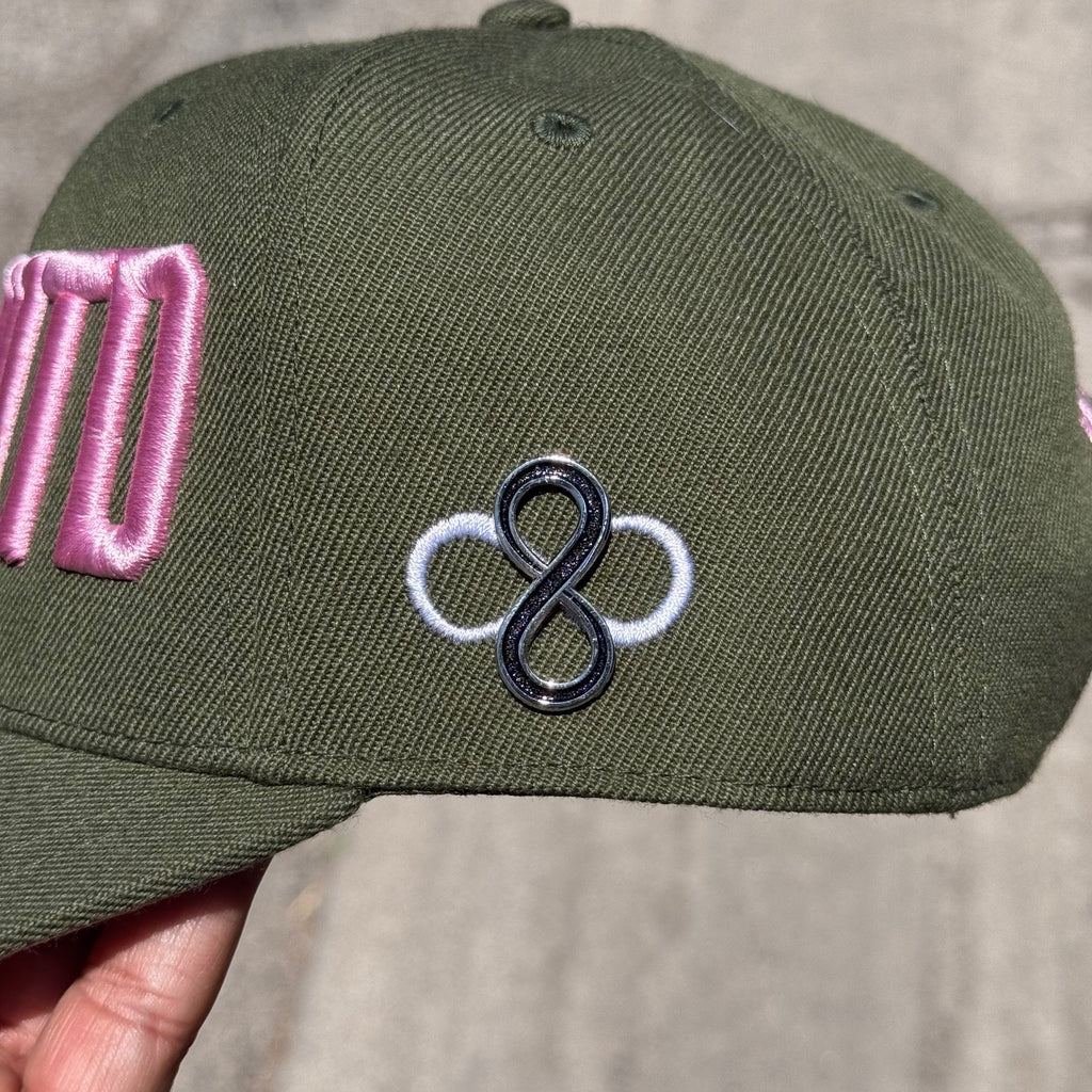Pin displayed on a green hat 