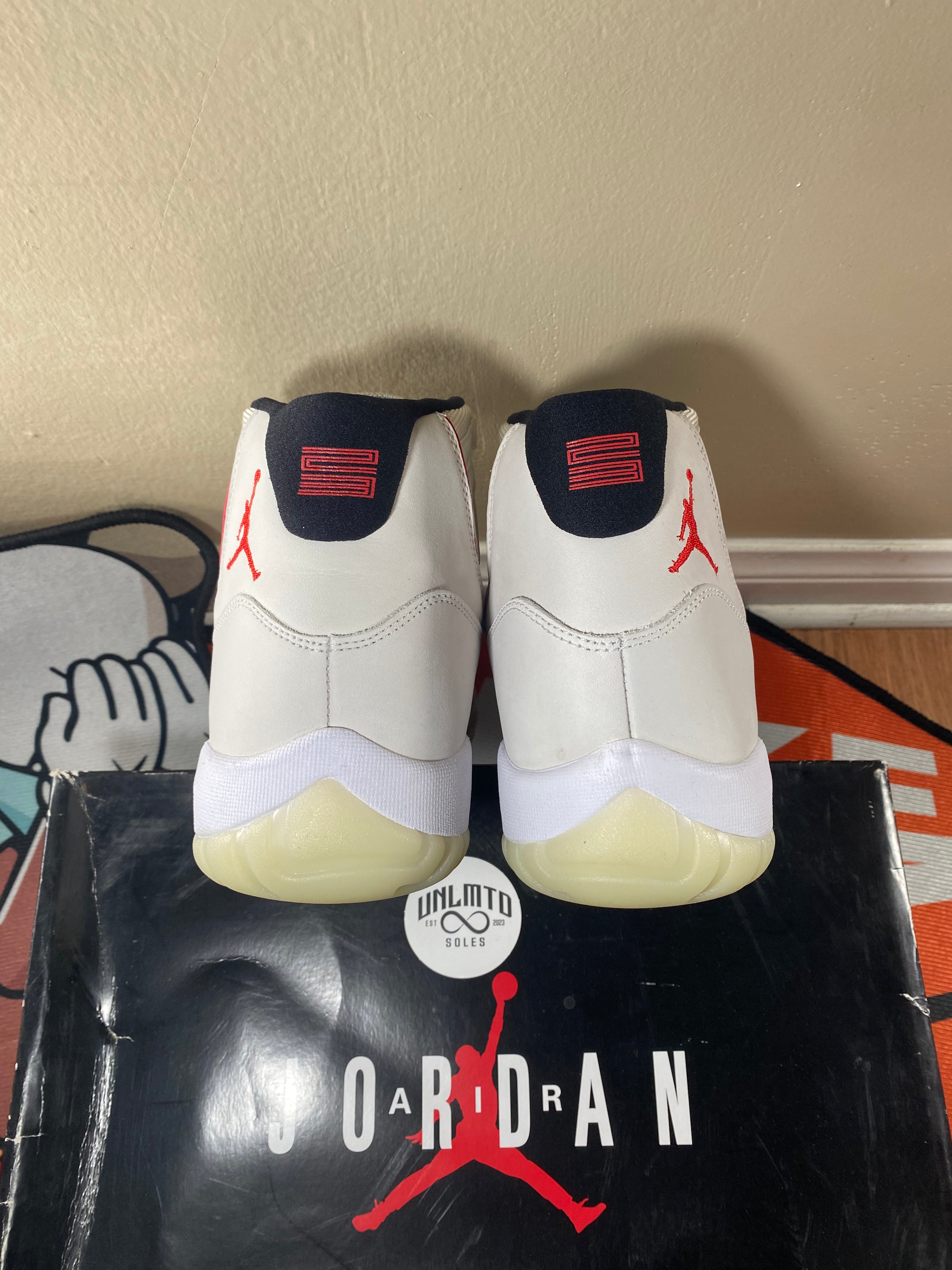Back of shoes with small red Jordan jumpman 
