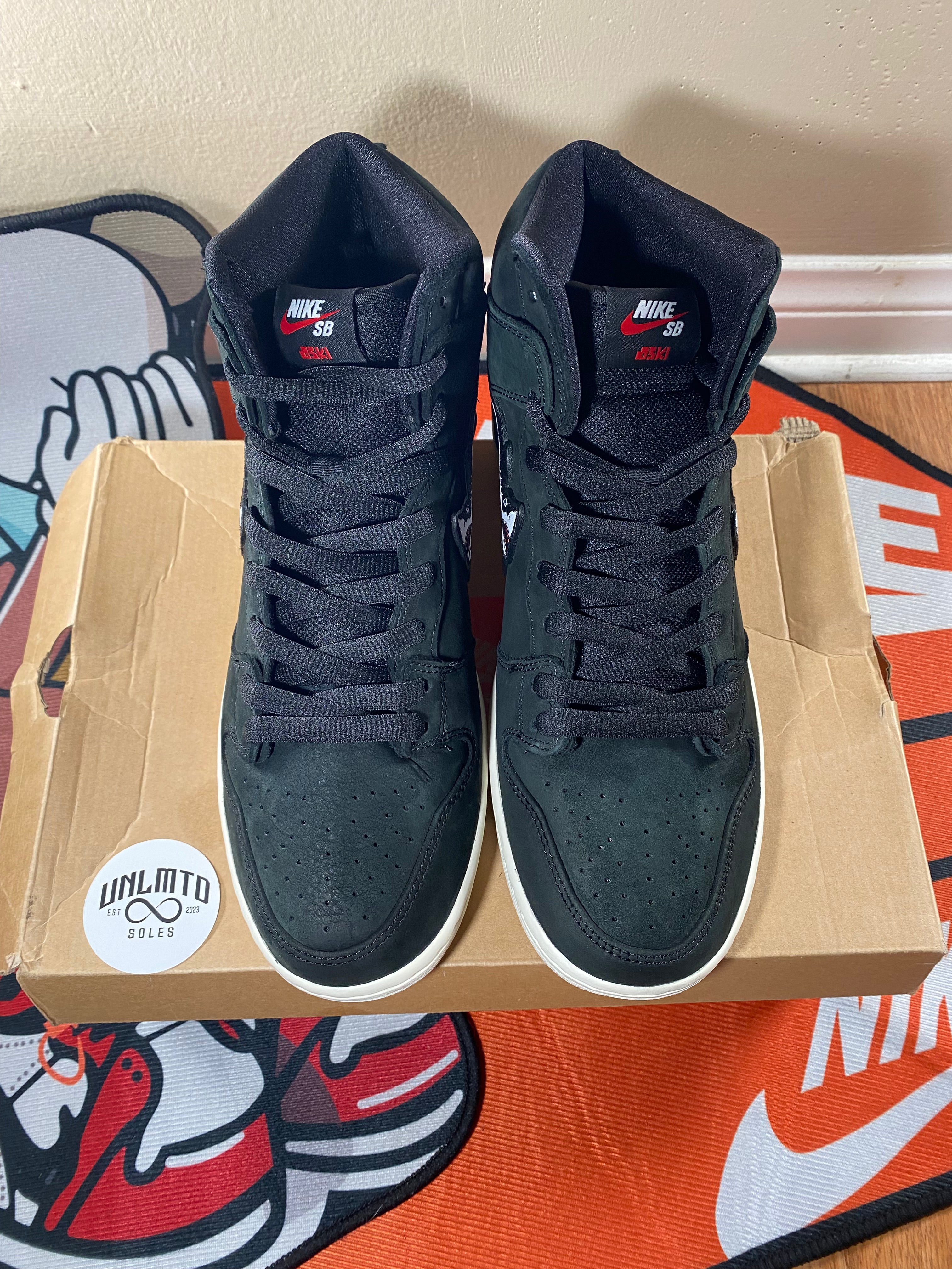 Top view of shoe,  black laces black tongue 