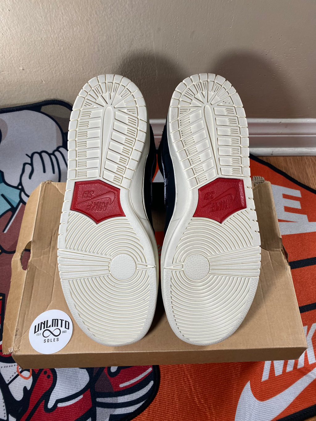 Bottom of shoe, white sole with red 