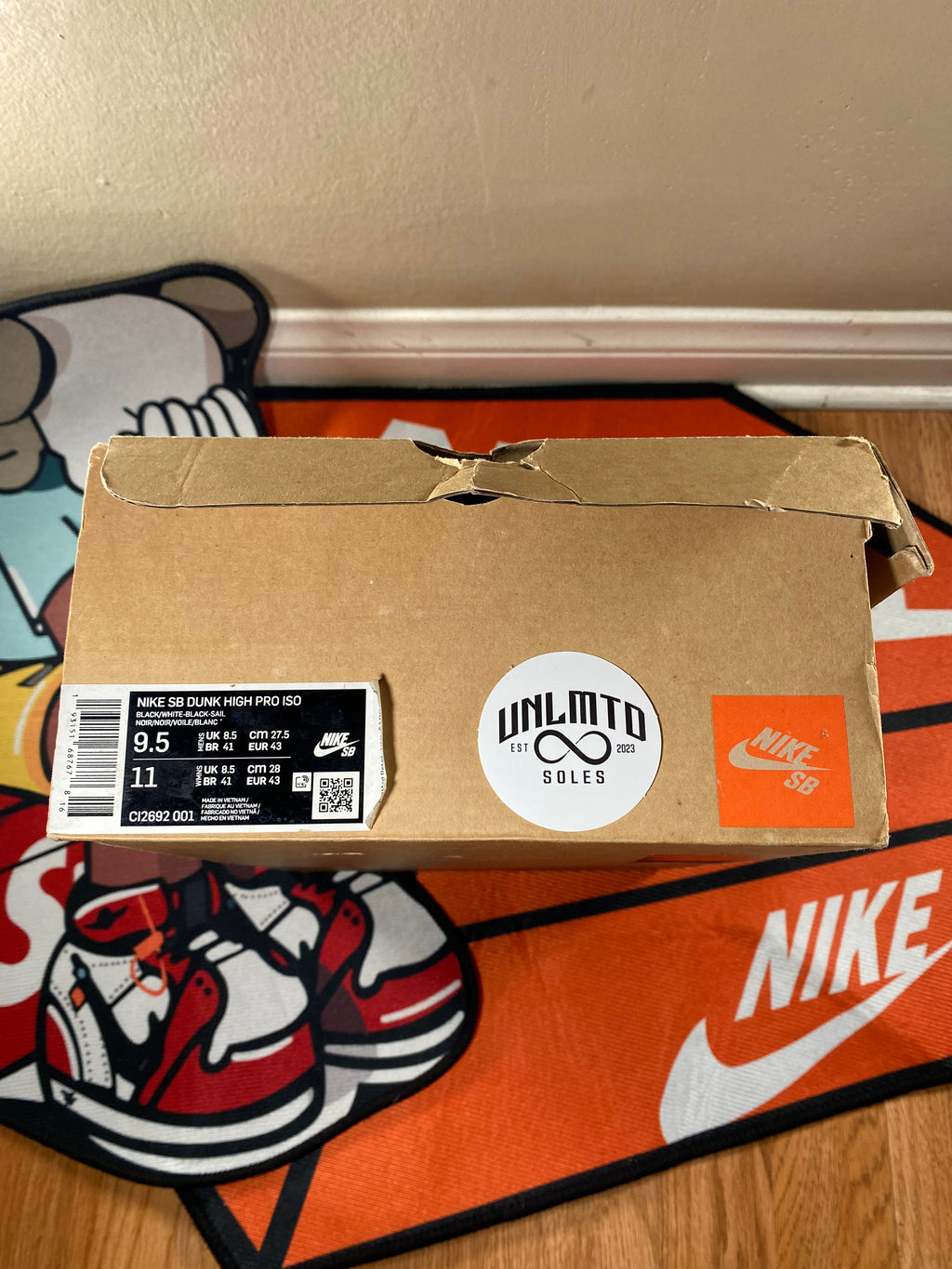 Brown shoe box with shoe description and 9.5 size 