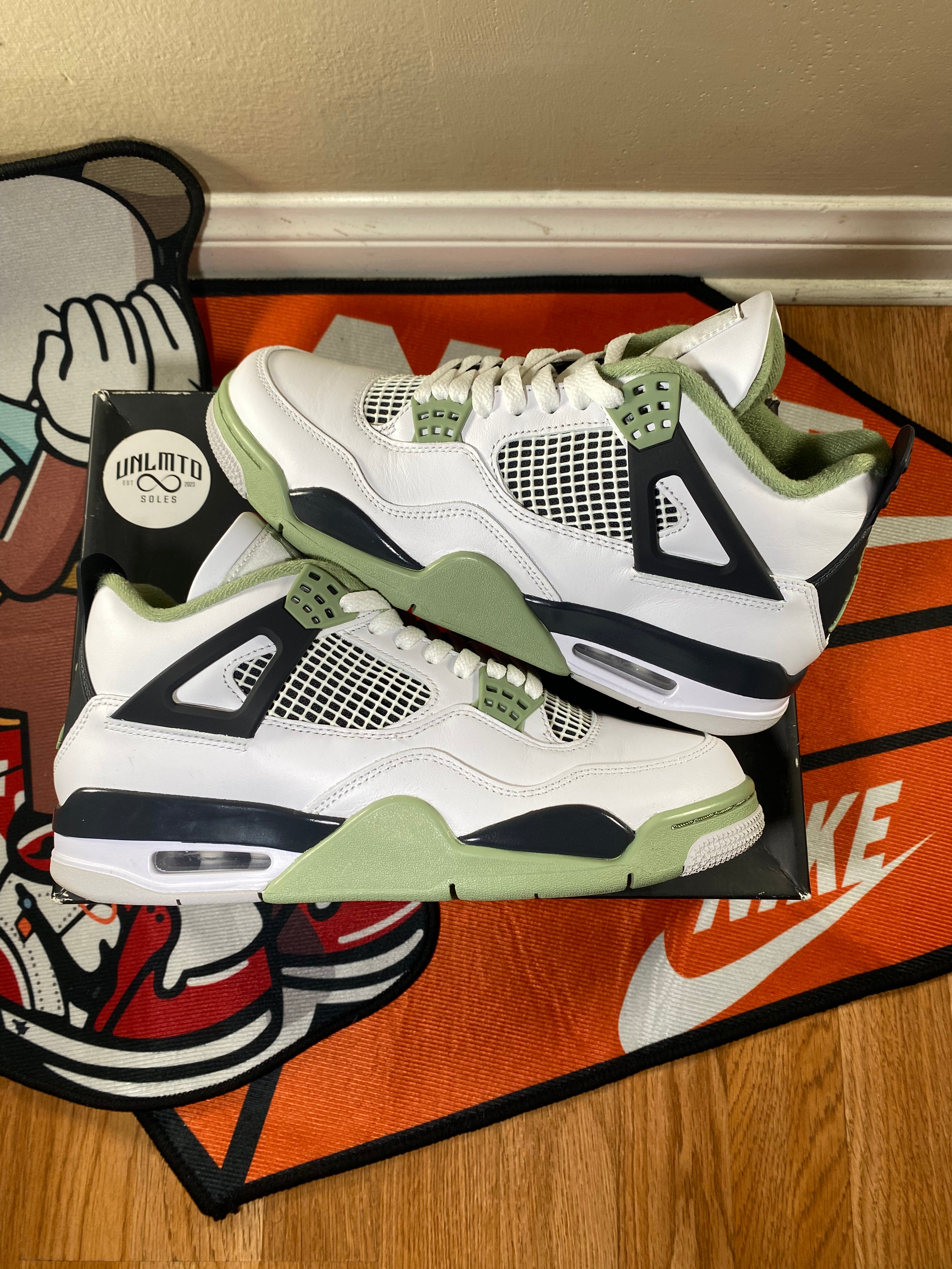 Jordan 4 Retro Seafoam (Women's) White with light green sneakers