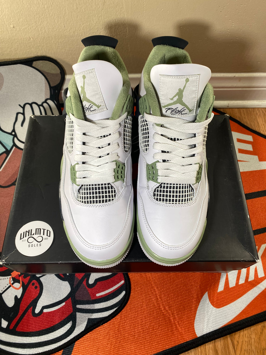 Top view of shoes white with white tongue and light green Jordan Jumpman 