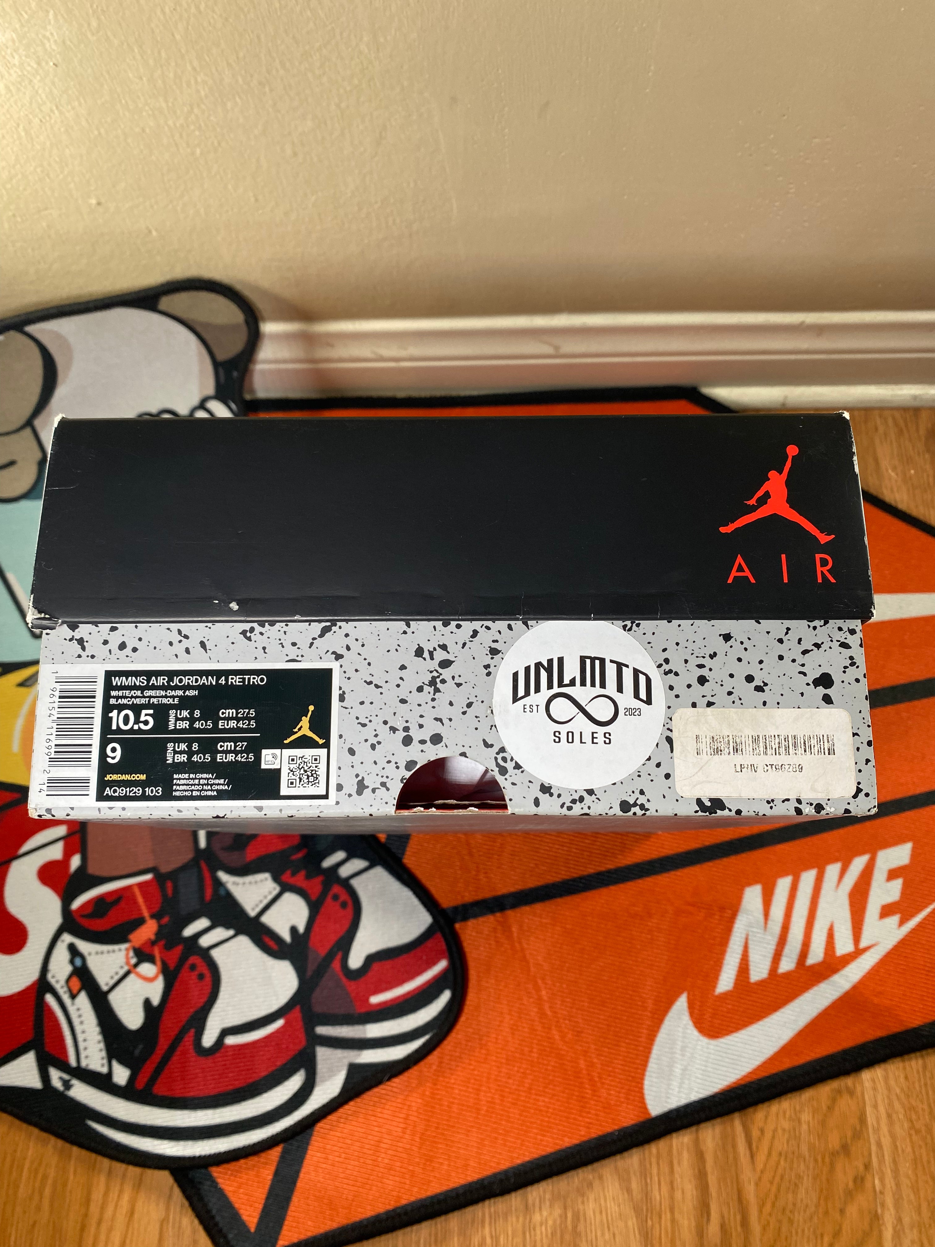 Box of Jordan sneakers with a visible brand logo on a surface women’s 10.5 