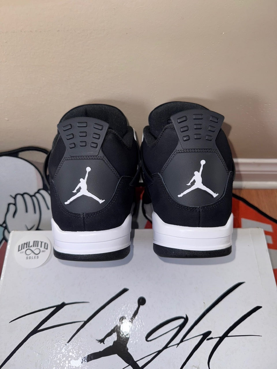 Back of shoe black work white midsole and white Jordan jumpman 
