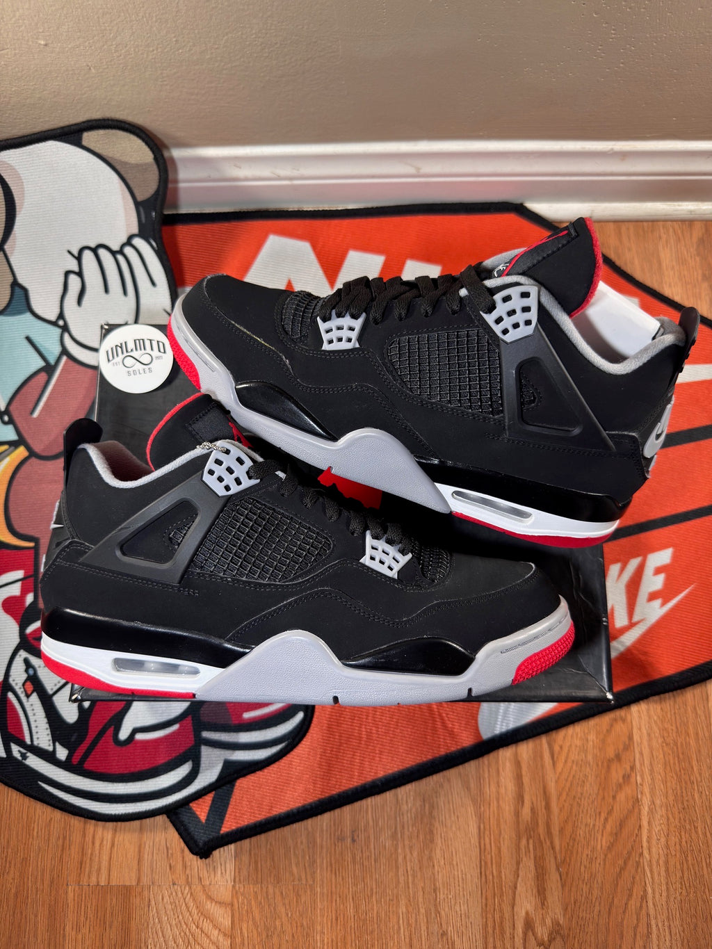 Preowned Jordan 4 Retro Bred (2019) size 11 black white grey and red 