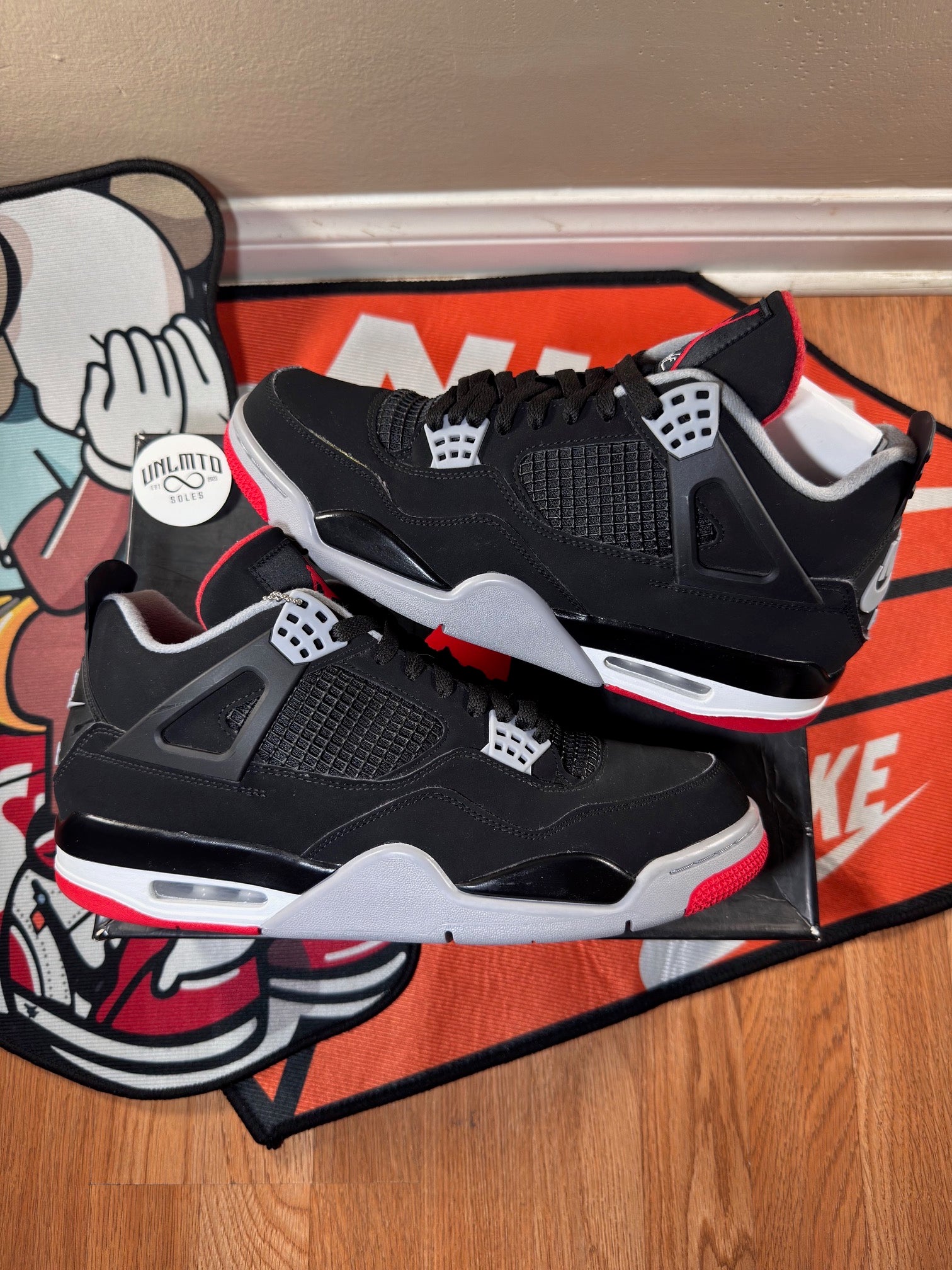 Preowned Jordan 4 Retro Bred (2019) size 11 black white grey and red 