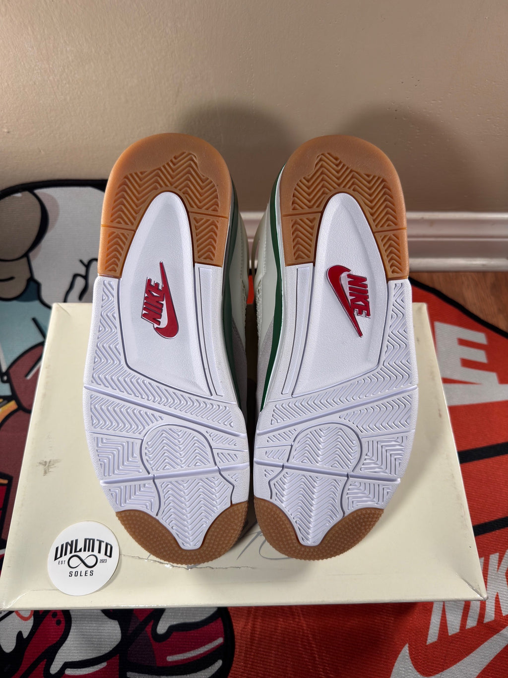 White and beige soles, red Nike logo 