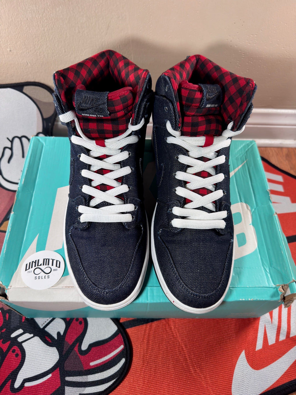 Top view, plaid red and black tongue, white shoe laces 