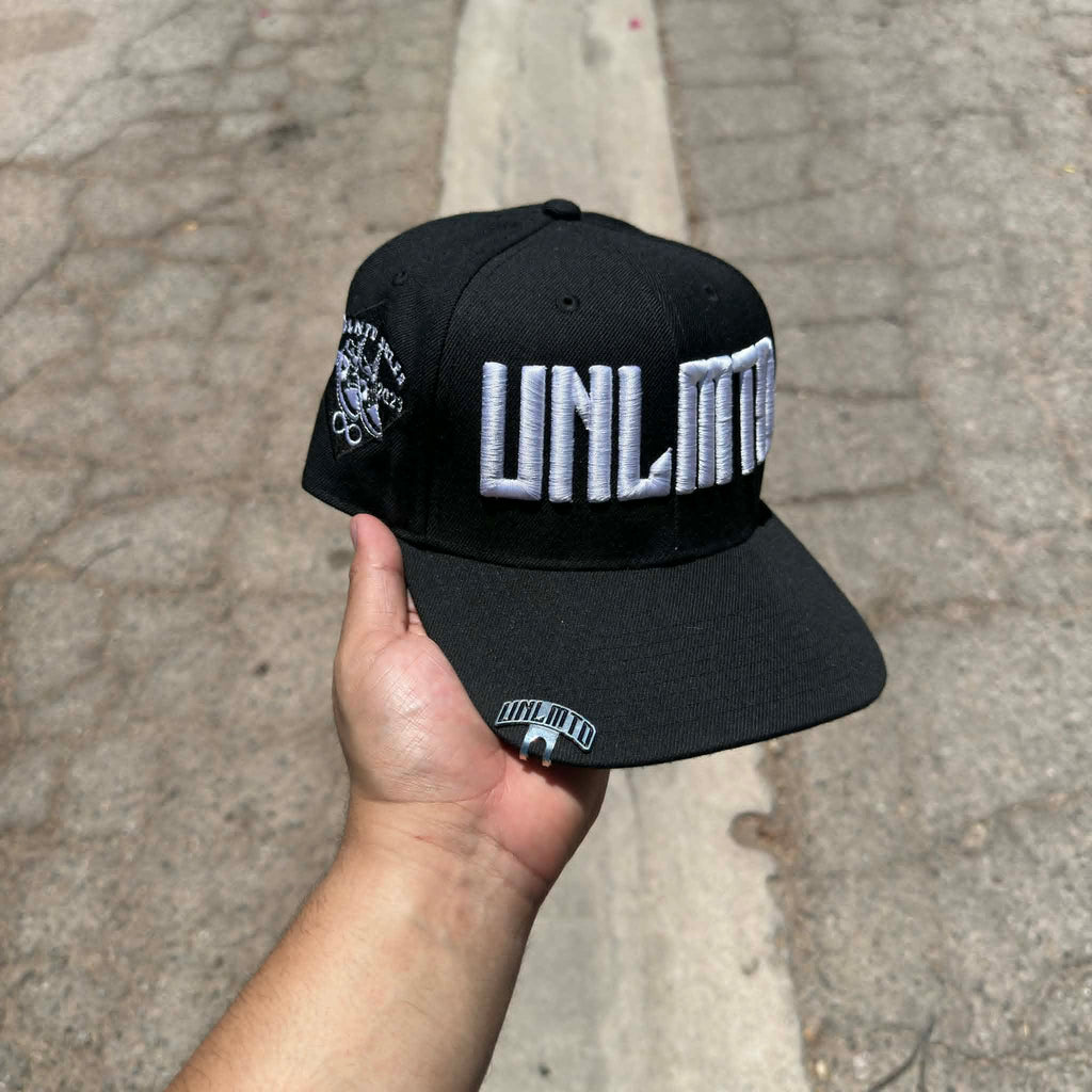 Black cap with white 'UNLMTD' branding